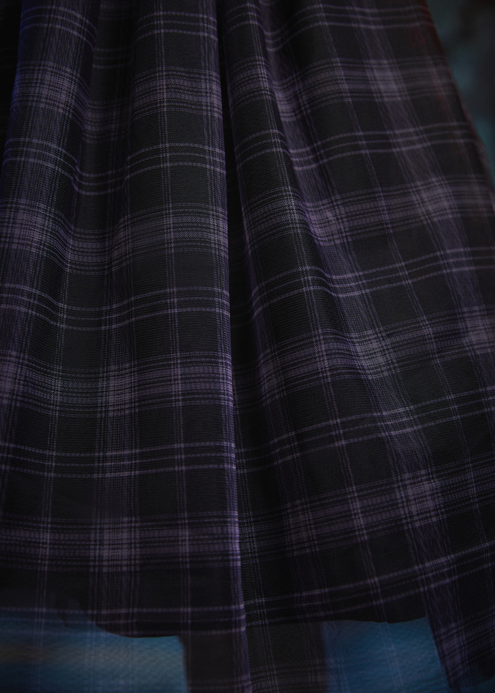 Close-up of the Spellbound Plaid tulle overlay showcasing the layered plaid fabric and soft, airy texture on a ModCloth dress.