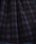 Close-up of the Spellbound Plaid tulle overlay showcasing the layered plaid fabric and soft, airy texture on a ModCloth dress.