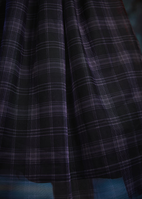 Close-up of the Spellbound Plaid tulle overlay showcasing the layered plaid fabric and soft, airy texture on a ModCloth dress.