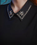 Close-up of the jeweled Peter Pan collar on the Evening Enchantment Fit & Flare Dress featuring sparkling rhinestone embellishments. 