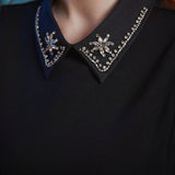 Close-up of the jeweled Peter Pan collar on the Evening Enchantment Fit & Flare Dress featuring sparkling rhinestone embellishments. 