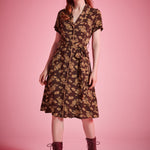 Brown floral shirt dress with contrast piping and rounded notch collar detail