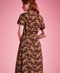 Back view of brown floral short sleeve shirt dress with flowing silhouette