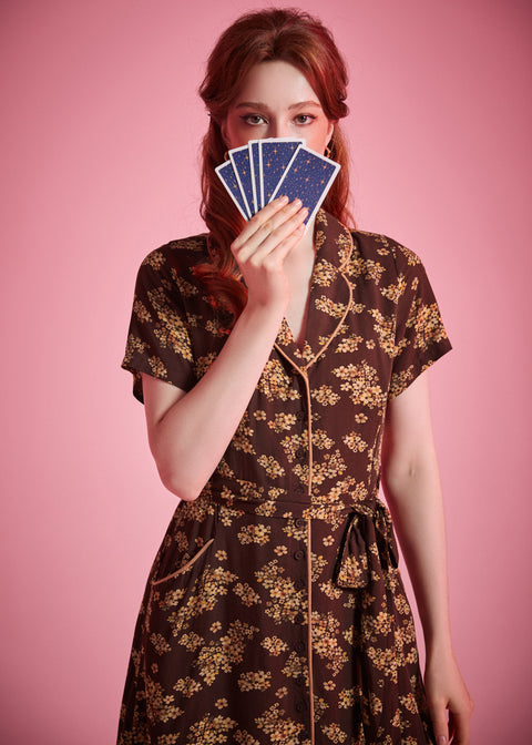 Woman wearing ModCloth Going Out and About brown floral shirt dress with pockets and removable tie belt