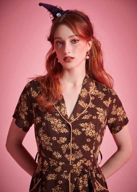 Brown floral viscose shirt dress with full button-front closure and vintage-inspired silhouette