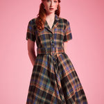 Woman wearing ModCloth Rustic Elegance Casual Dress in Harvest Tartan with removable buckle belt