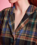 Close-up of notched collar and heritage plaid pattern on ModCloth dress