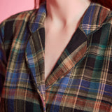 Close-up of notched collar and heritage plaid pattern on ModCloth dress
