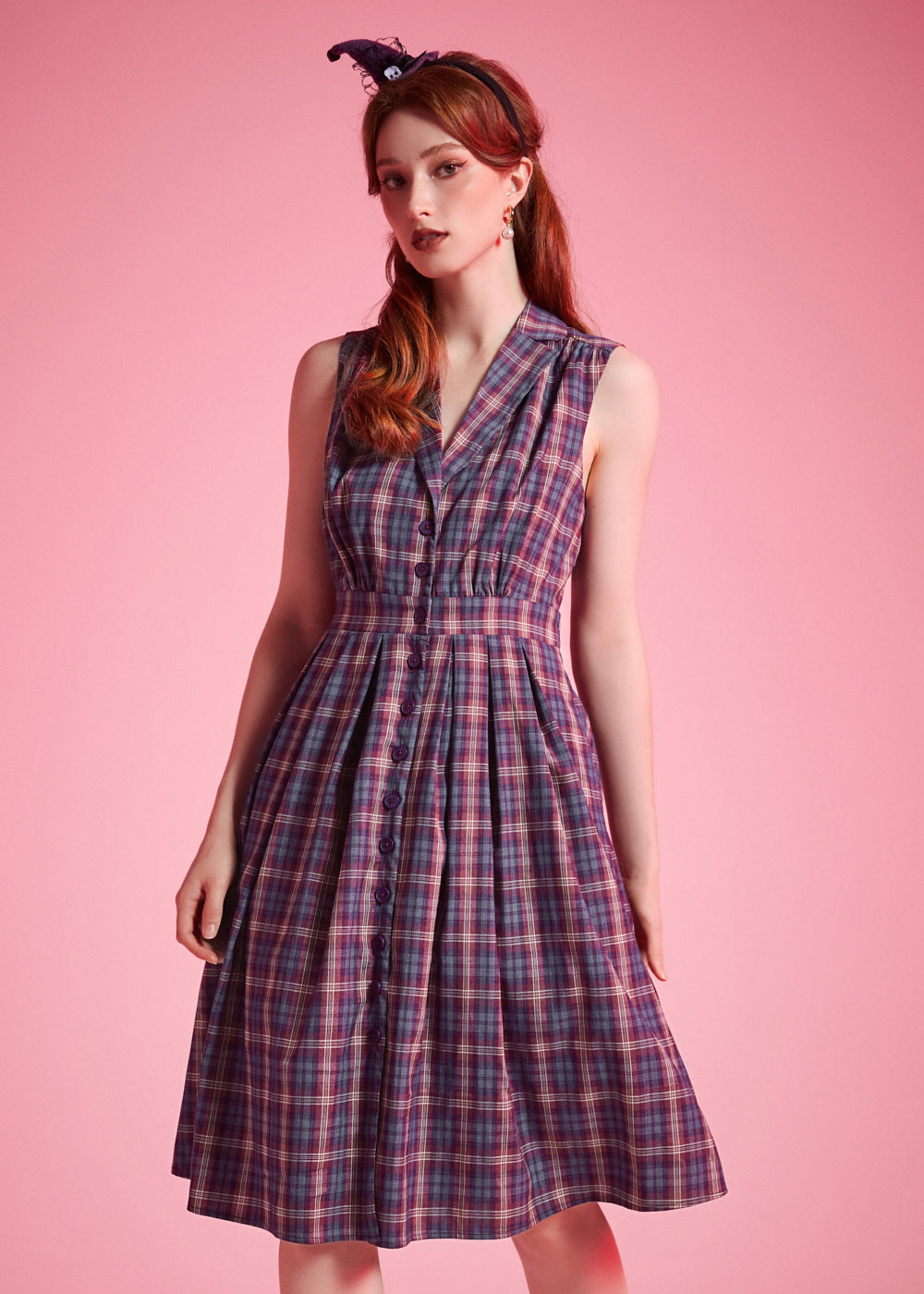 Full-length view of vintage-inspired plaid midi dress with fit-and-flare silhouette