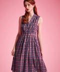 Full-length view of vintage-inspired plaid midi dress with fit-and-flare silhouette