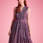 Full-length view of vintage-inspired plaid midi dress with fit-and-flare silhouette
