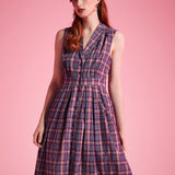 Full-length view of vintage-inspired plaid midi dress with fit-and-flare silhouette