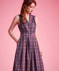 Woman wearing ModCloth Carousel Cutie sleeveless plaid fit-and-flare dress