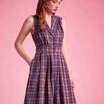 Woman wearing ModCloth Carousel Cutie sleeveless plaid fit-and-flare dress