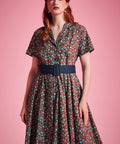 Floral cotton ModCloth dress with contrast piping, removable belt, and side pockets