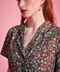 Close-up of contrast piping and floral print on ModCloth Rustic Elegance Casual Dress