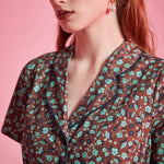 Close-up of contrast piping and floral print on ModCloth Rustic Elegance Casual Dress