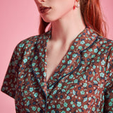 Close-up of contrast piping and floral print on ModCloth Rustic Elegance Casual Dress
