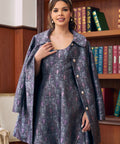 Woman wearing Art Nouveau-inspired bat and crescent moon coat with matching dress sold separately