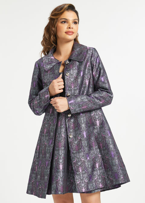 Woman wearing vintage-inspired bat brocade coat with matching dress sold separately