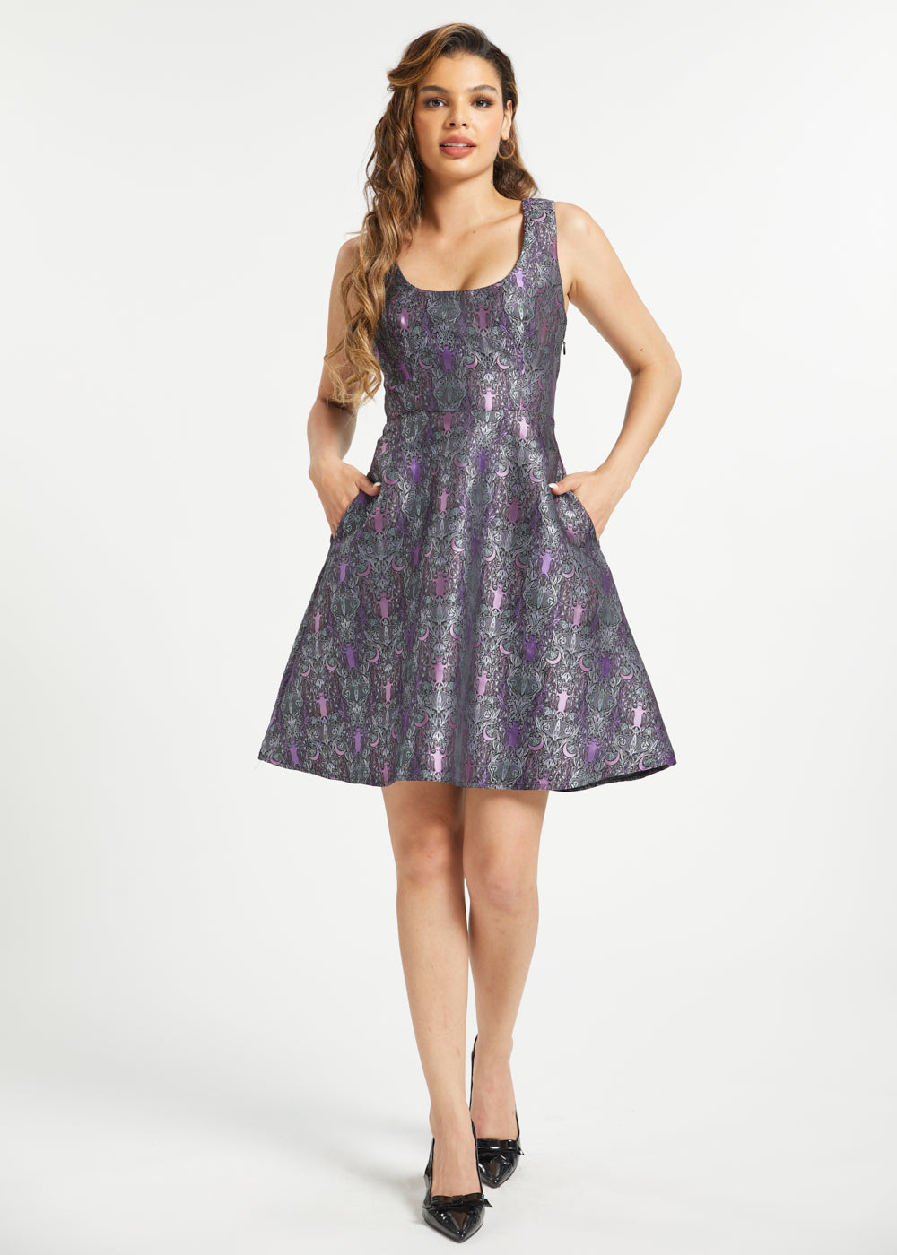 Woman wearing purple gothic fit and flare dress with ornate bat crescent moon print