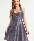 Woman wearing dark academia fit and flare dress with purple bat and moon pattern
