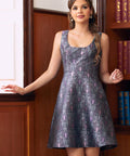 Woman wearing gothic bat print above the knee length dress with sleeveless scoop neckline