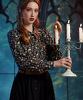 Woman wearing ModCloth 100% cotton gothic skull print blouse with long puff sleeves