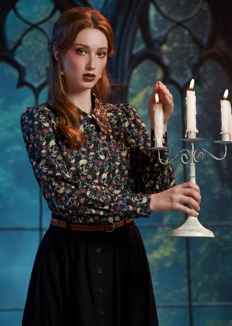 Woman wearing ModCloth 100% cotton gothic skull print blouse with long puff sleeves