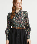 Woman wearing Hoot & Haute cotton blouse in Dead Gorgeous skull floral print