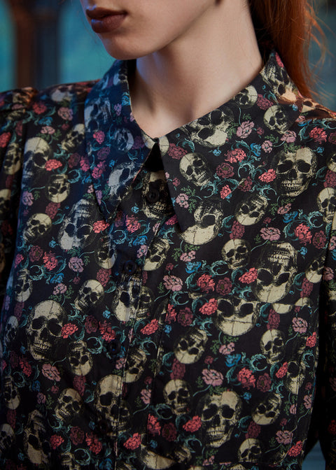 Close-up of women's gothic skull floral print 100% cotton button-up blouse 
