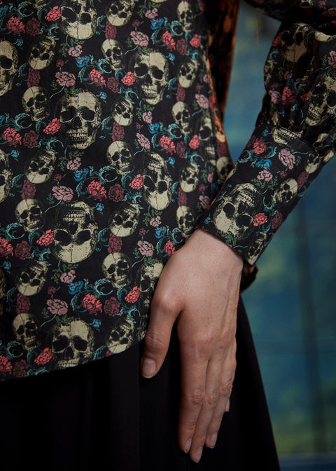 Detail of women's skull and rose print cotton blouse with long sleeve and wide cuff
