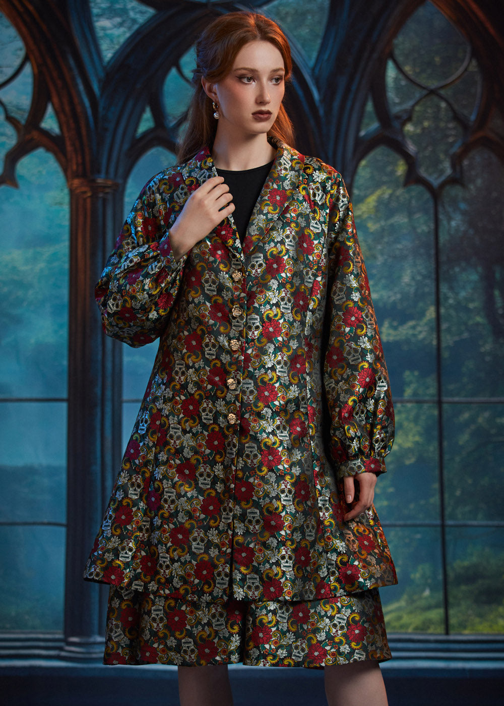 Woman wearing ModCloth Midnight Soirée Dress Coat in Memento Mori featuring a vintage-inspired A-line silhouette, skull buttons, and floral sugar skull jacquard.