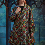 Woman wearing ModCloth Midnight Soirée Dress Coat in Memento Mori featuring a vintage-inspired A-line silhouette, skull buttons, and floral sugar skull jacquard.