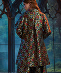 Back view of the Midnight Soirée Dress Coat in Memento Mori highlighting the elegant A-line silhouette and allover floral sugar skull jacquard.