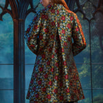 Back view of the Midnight Soirée Dress Coat in Memento Mori highlighting the elegant A-line silhouette and allover floral sugar skull jacquard.