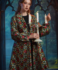 Woman wearing the ModCloth Midnight Soirée Dress Coat in Memento Mori styled over the coordinating Midnight Soirée Fit & Flare Dress.