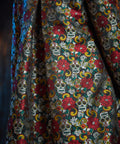 Close-up of the Memento Mori jacquard fabric highlighting the woven floral and sugar skull motif.