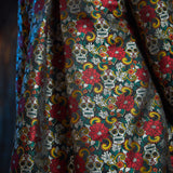 Close-up of the Memento Mori jacquard fabric highlighting the woven floral and sugar skull motif.