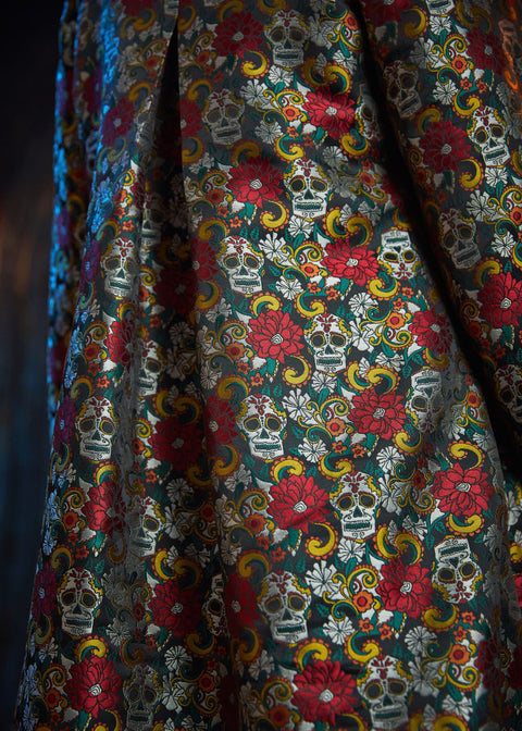 Close-up of the Memento Mori jacquard fabric highlighting the woven floral and sugar skull motif.