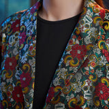 Close-up of the notched lapels on the Midnight Soirée Dress Coat showcasing the intricate floral sugar skull jacquard weave.