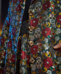 Close-up of the signature skull-shaped buttons on the Midnight Soirée Dress Coat.