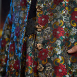 Close-up of the signature skull-shaped buttons on the Midnight Soirée Dress Coat.