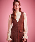 Woman wearing ModCloth button front jumper dress with patch pockets in Autumn Auburn