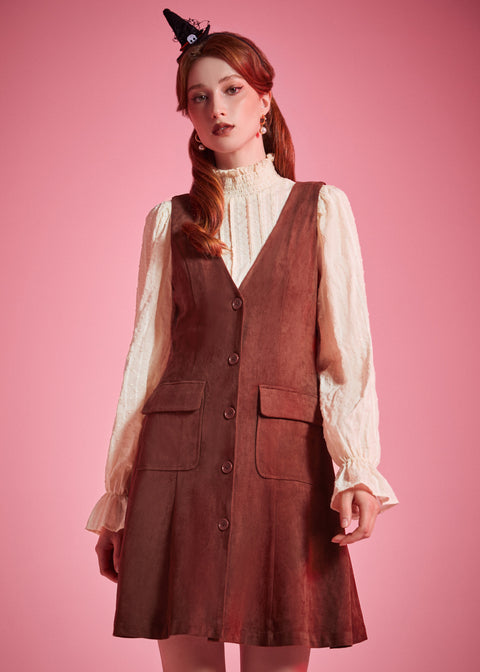 Woman wearing Study Hall Sweetheart jumper dress in Autumn Auburn with patch pockets
