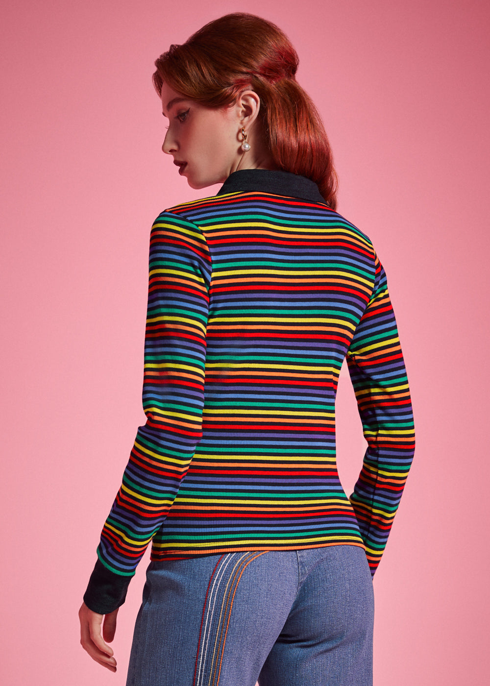 Back view of women's rainbow striped long sleeve polo top with black contrast collar