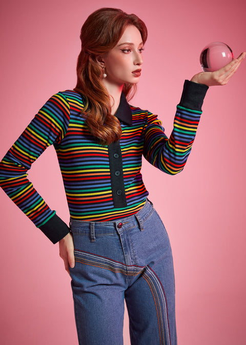 Women's fitted rainbow stripe polo top with long sleeves, black cuffs, and button-front placket