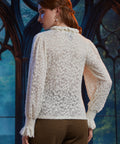 Back view of women's ivory floral lace blouse with long sheer sleeves