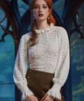 Women's ivory sheer floral lace blouse with long sleeves and ruffled cuffs