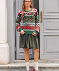 Full-length view of woman wearing green squirrel sweater with olive midi skirt